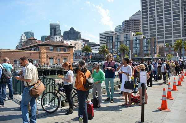 Ferry passengers waiting in line on second day of BART strike, photo by Steve Rhodes .