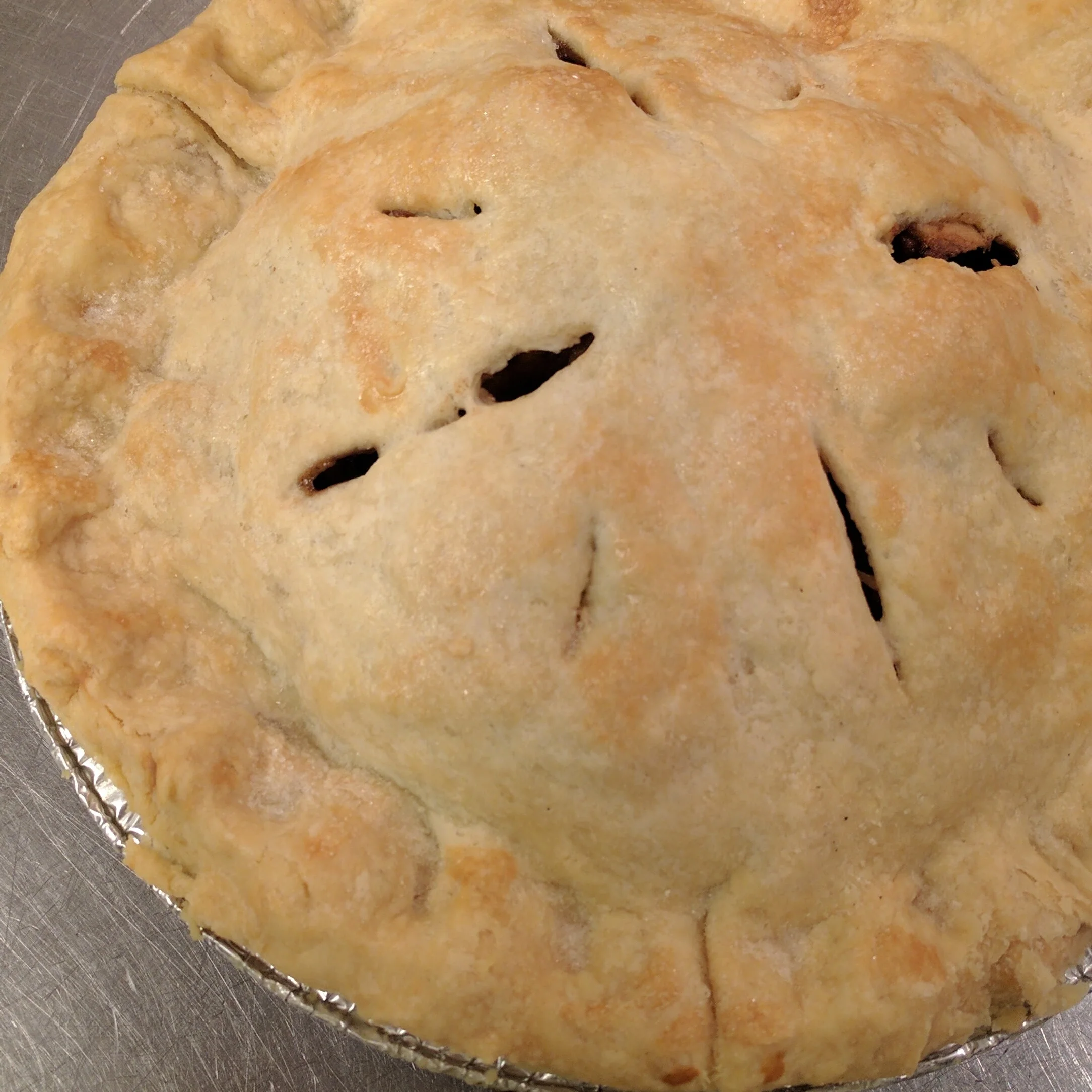 Apple Generously heaped with spiced apples; topped with a flaky, hand-rolled crust and a sprinkling of sugar. $18