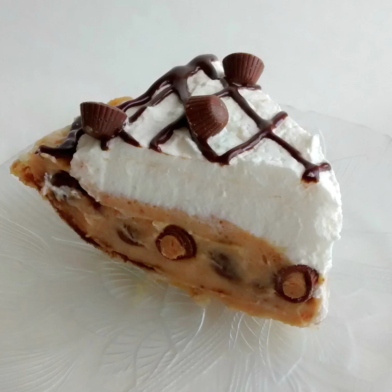 Peanut Butter Cream A creamy, peanut buttery pie, studded with miniature peanut butter cups, and topped with whipped cream, chocolate ganache, and even more peanut butter cups! $24