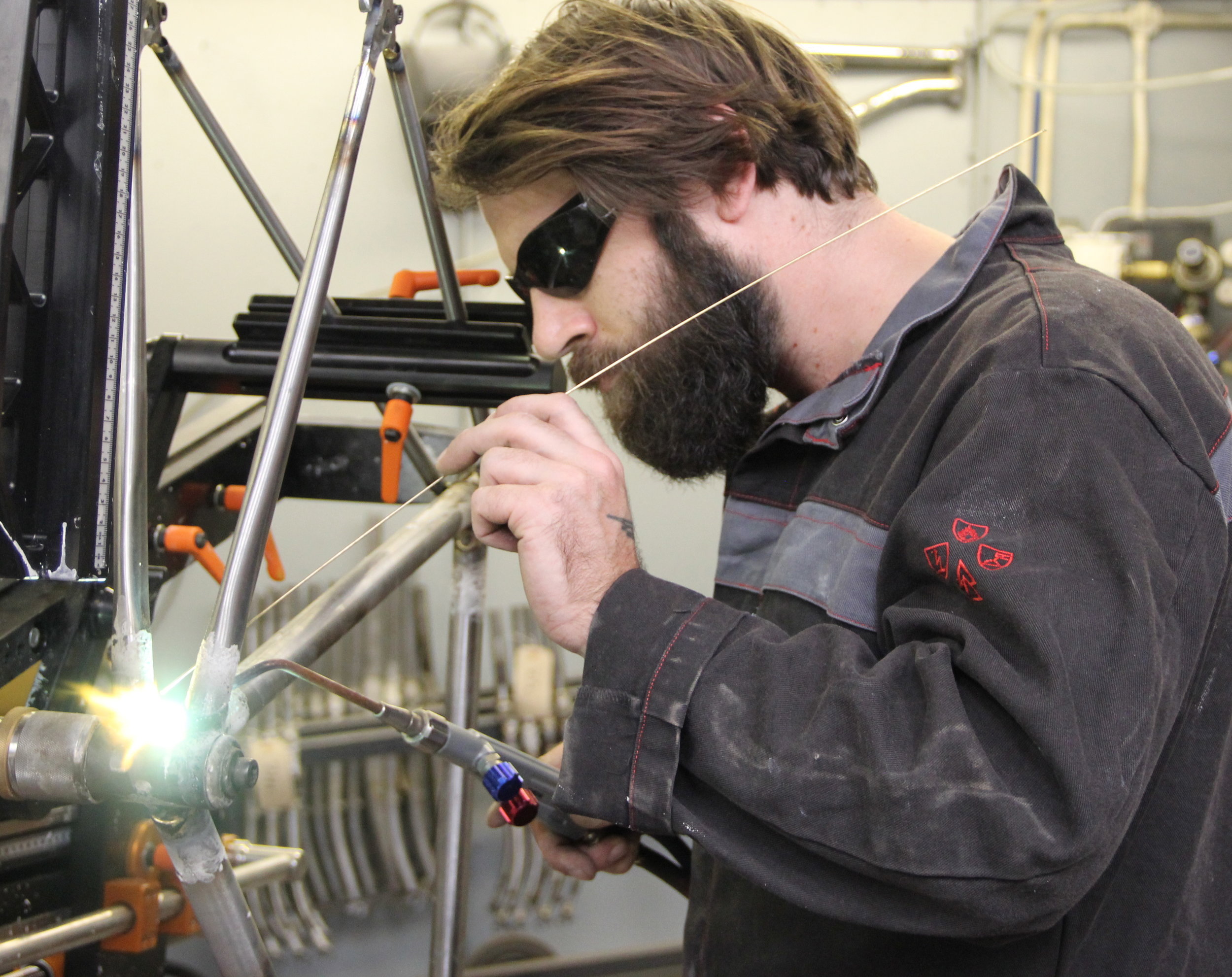 Michael brazes some Reynolds tubing together