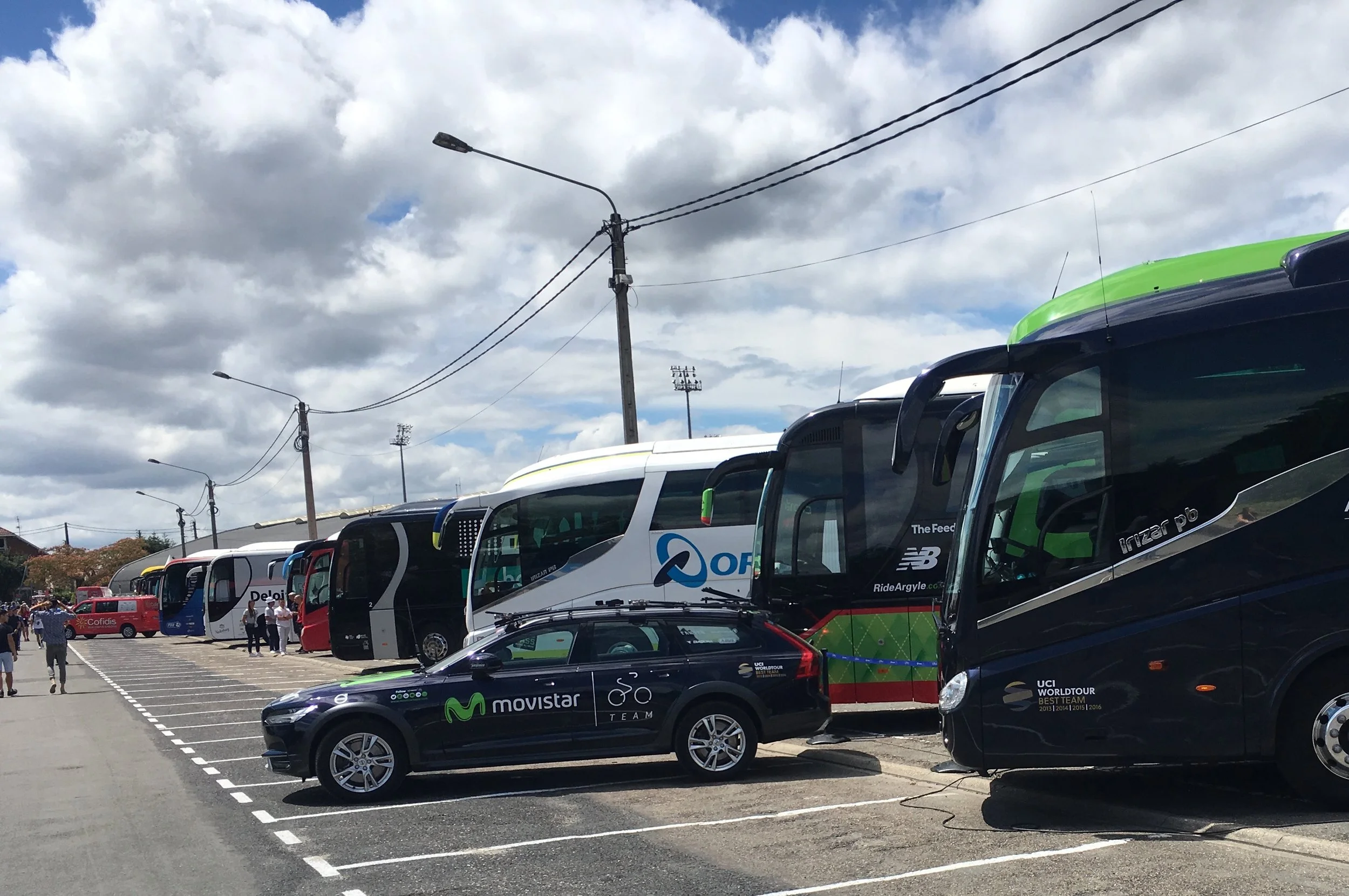 Team buses prepare for the riders' arrival
