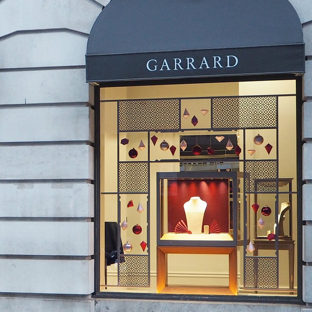 The Grafton street fa&ccedil;ade showing 4 of the 7 festive windows we designed, produced &amp; installed for House of Garrard&rsquo;s London flagship boutique.