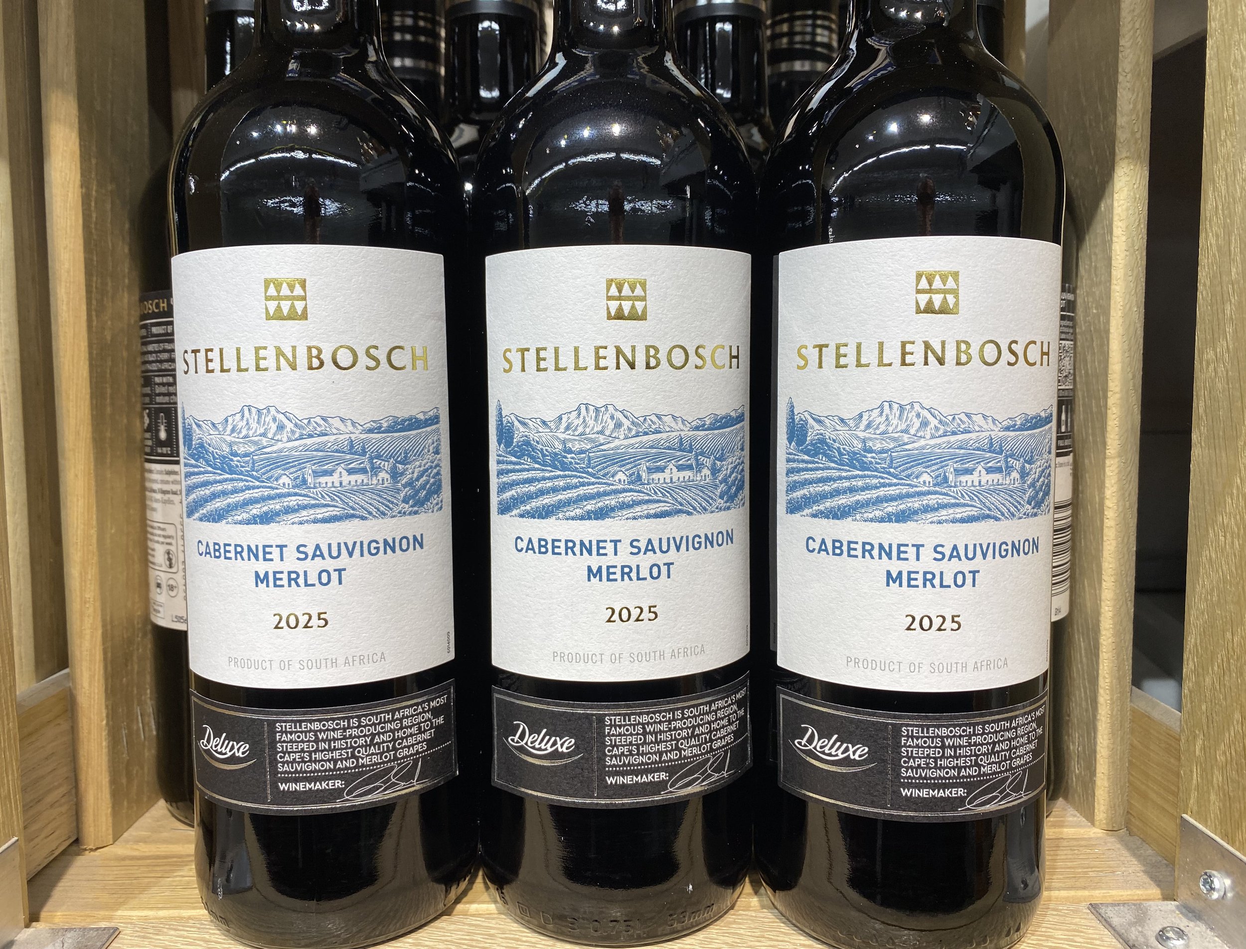 photo of wine labels depicting a scratchboard style illustration