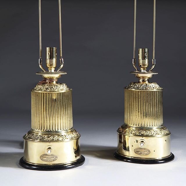 A small pair of table lamps. Patent colza oil originally now powered by electricity. Very crisp repousse brass