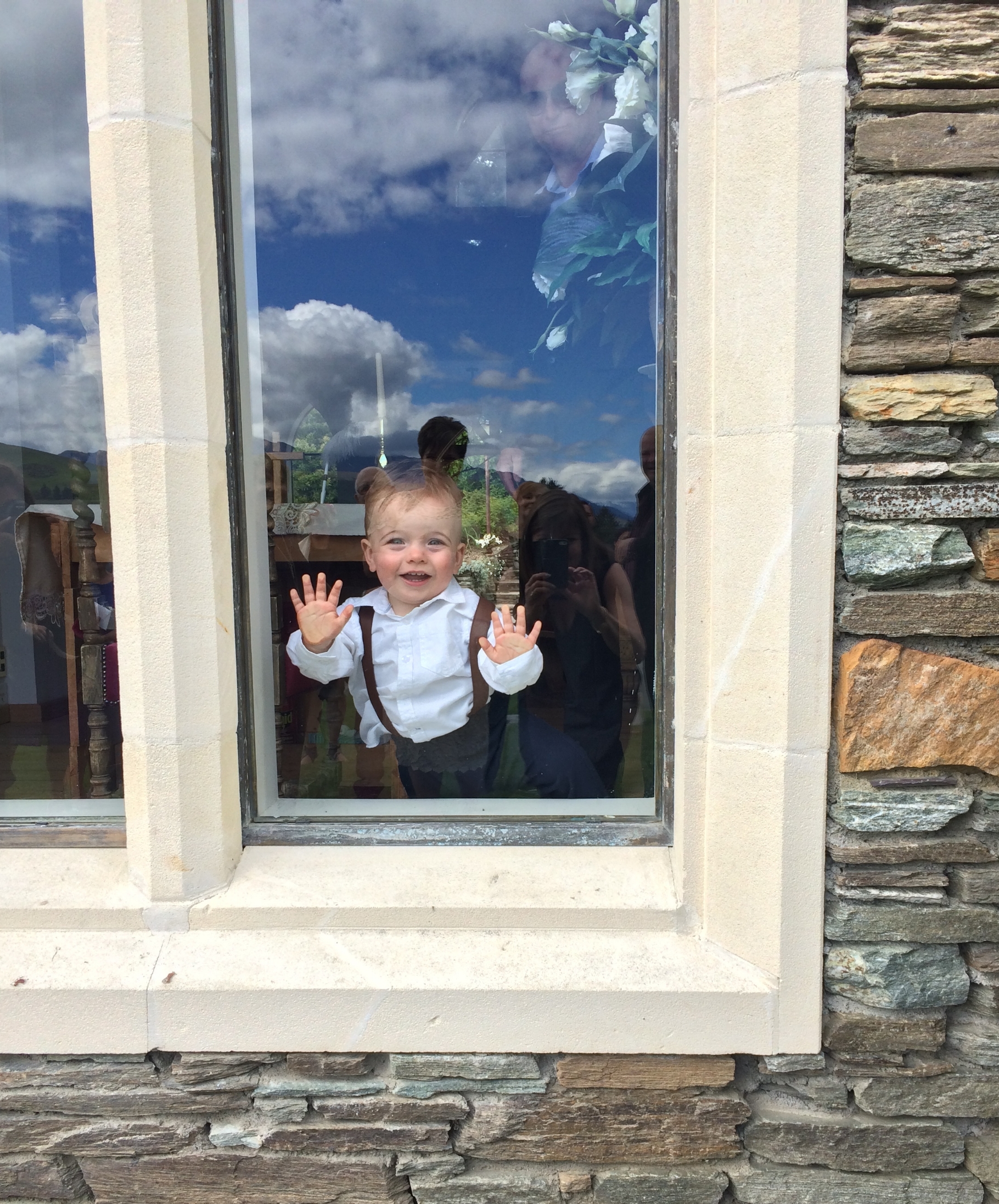 Little Austin (photo used with kind permission) loved the Chapel at Stoneridge so much that he toddled back inside to enjoy the large window!