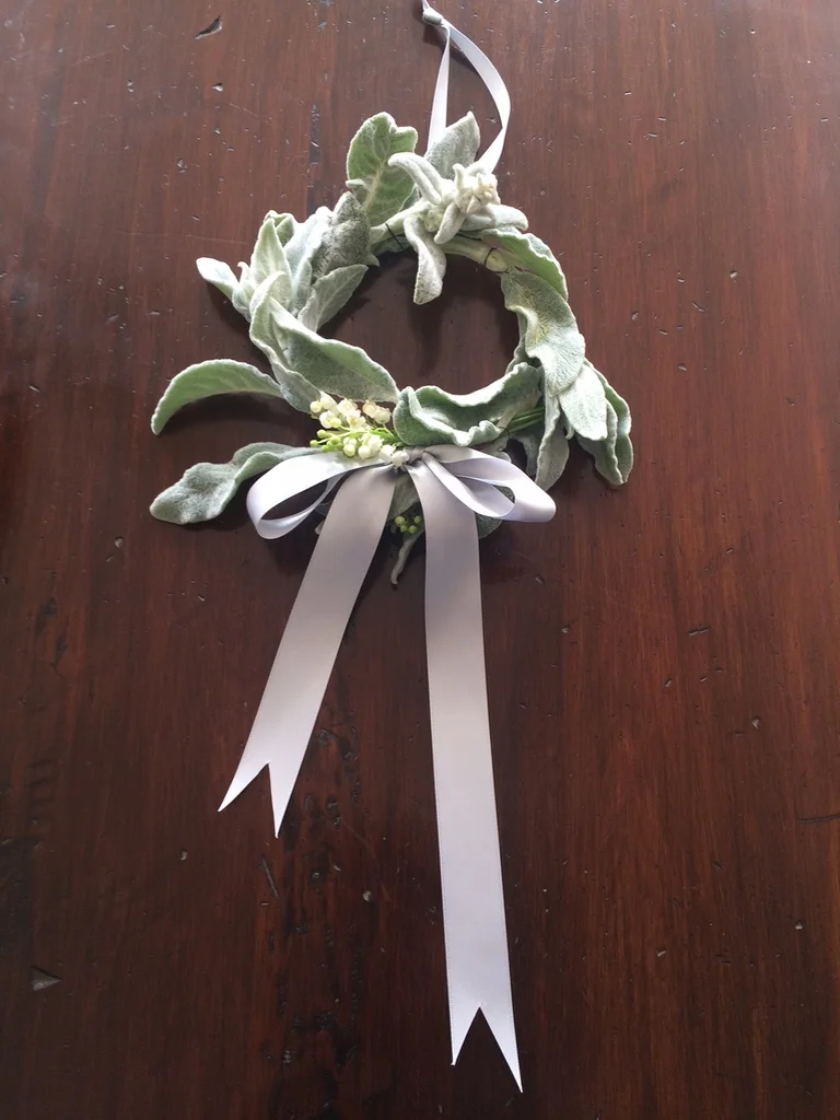 I made this little hoop with Lamb’s Ears and Lily of the Valley from the garden. You could use any flower that toned.