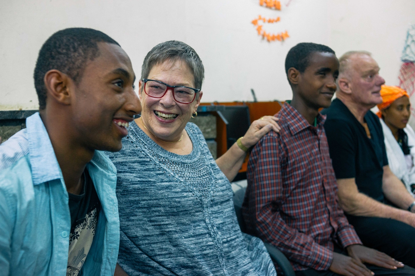 Sharon and George with the three children they sponsor