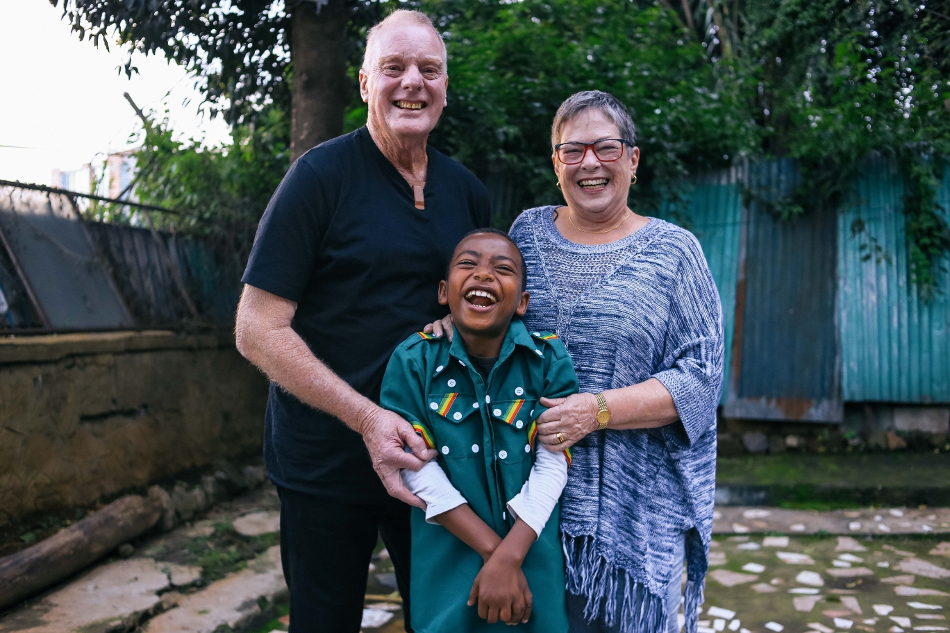 George and Sharon getting to know all the children in the program, with Yibeltal, at the BHE drop in center
