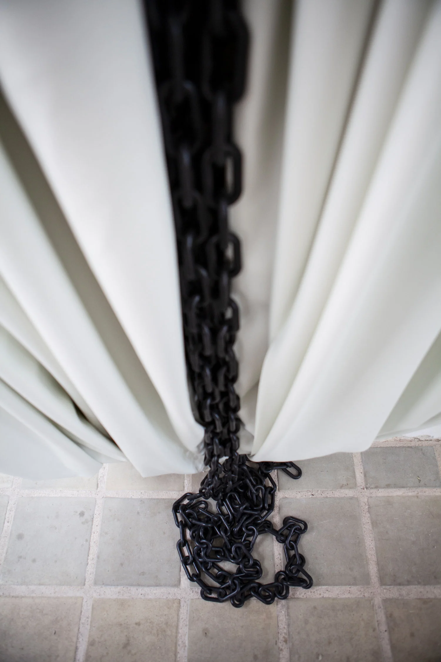 Livlængsel , materials: imitation leather, plastic chains, wood laths