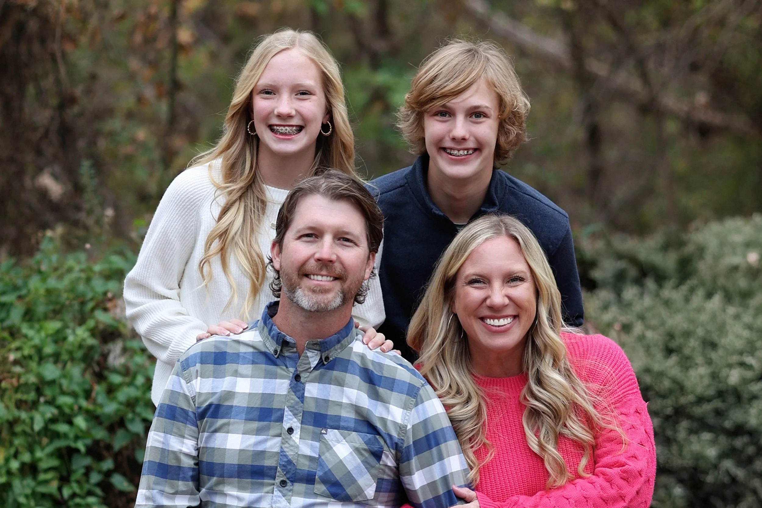 A family photo of Doctor Ward with his wife and two teenage children