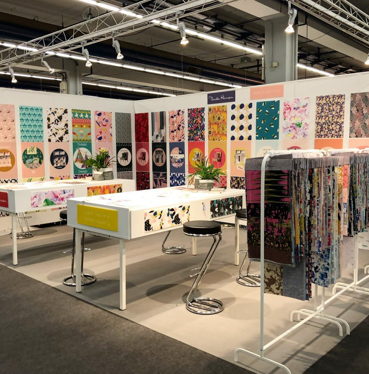 Colourful Posters Adorn the booth.
