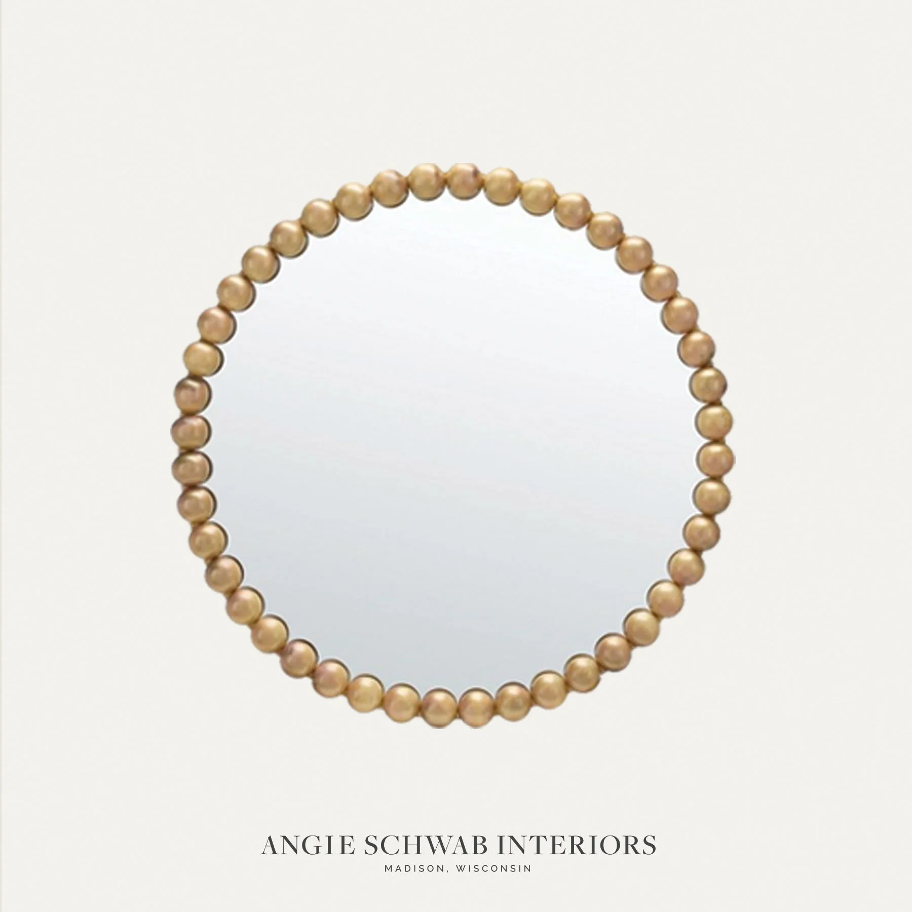 Sometimes it&rsquo;s simply about shape.

A round mirror softens hard lines, balances surrounding millwork, and creates a natural focal point. The beaded detail adds texture without overwhelming the space.

Interior Design | Waunakee WI