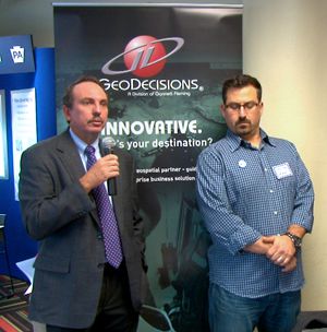 Greg Ulp discusses transportation solutions alongside GeoDecisions Developer Robert Angeli during 2015 Central PA GIS Day Celebration at Harrisburg Area Community College.