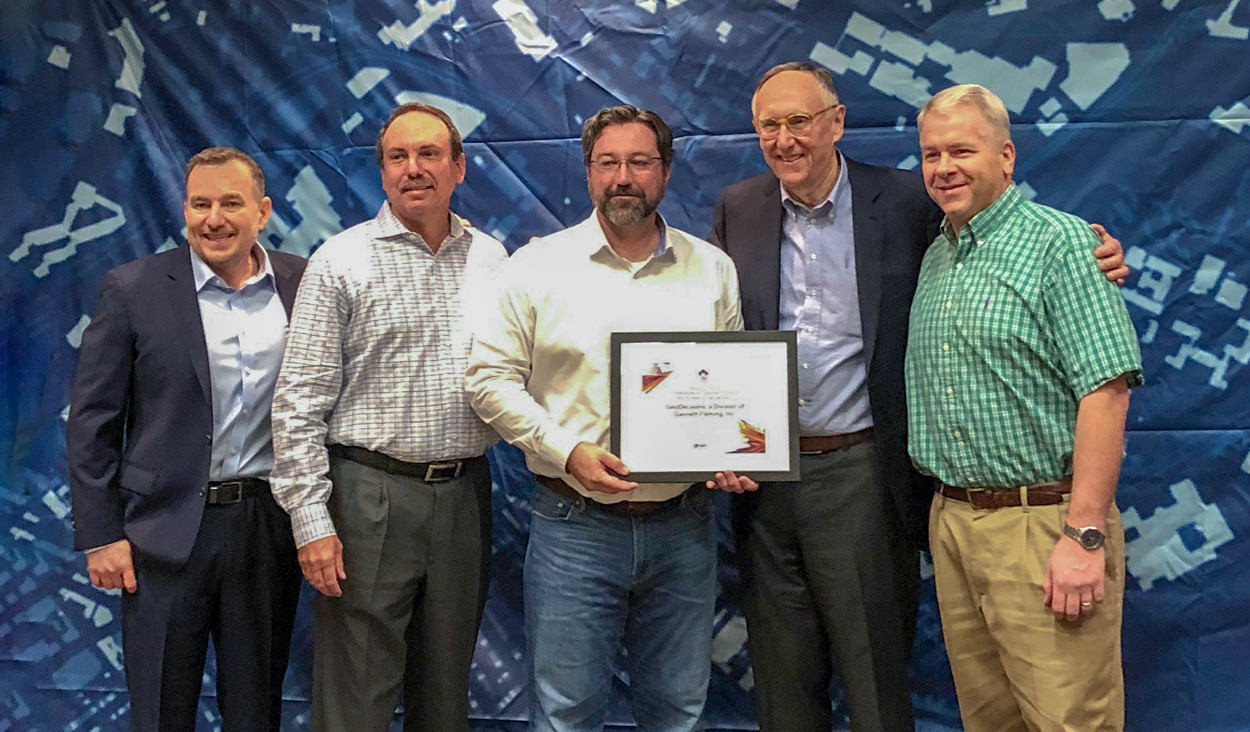 Esri presents GeoDecisions with Cornerstone Award at Esri Partner Conference in Palm Springs, CA, on Tuesday, March 4, 2019. Left to Right: Jeff Peters, director, Global Business Development, Esri; Greg Ulp, director, GeoDecisions; Brian Smith, vice president, GeoDecisions; Jack Dangermond, president, Esri; and Trent Park, senior vice president, GeoDecisions.