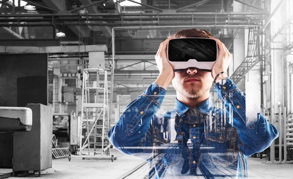 Interior of a building with a man using a virtual reality headset.
