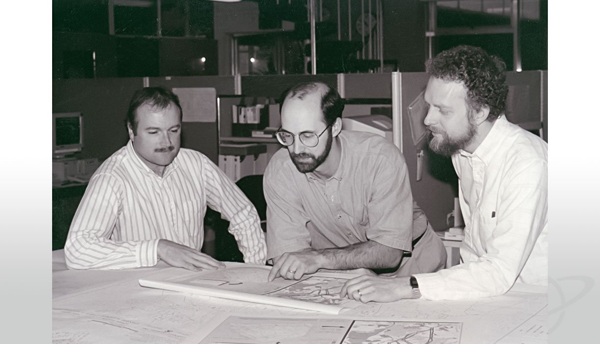 Dave and two of his co-workers compare geological maps with digitized GIS information in 1994. 