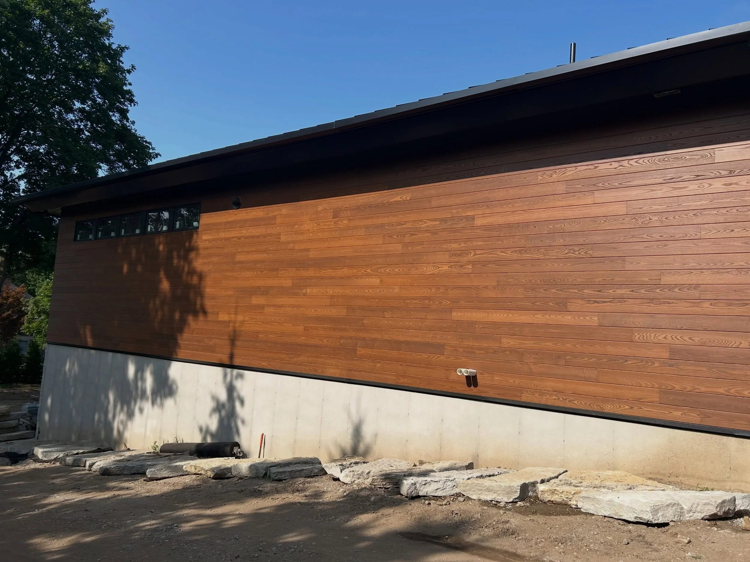 Our first projects with the updated ELMNT Collection are underway - Check out this in-progress job in Michigan featuring Ash ThermoWood&reg; in our ELMNT Iron colorway.

The ELMNT Collection is a durable, water-based, factory pre-finished collection 