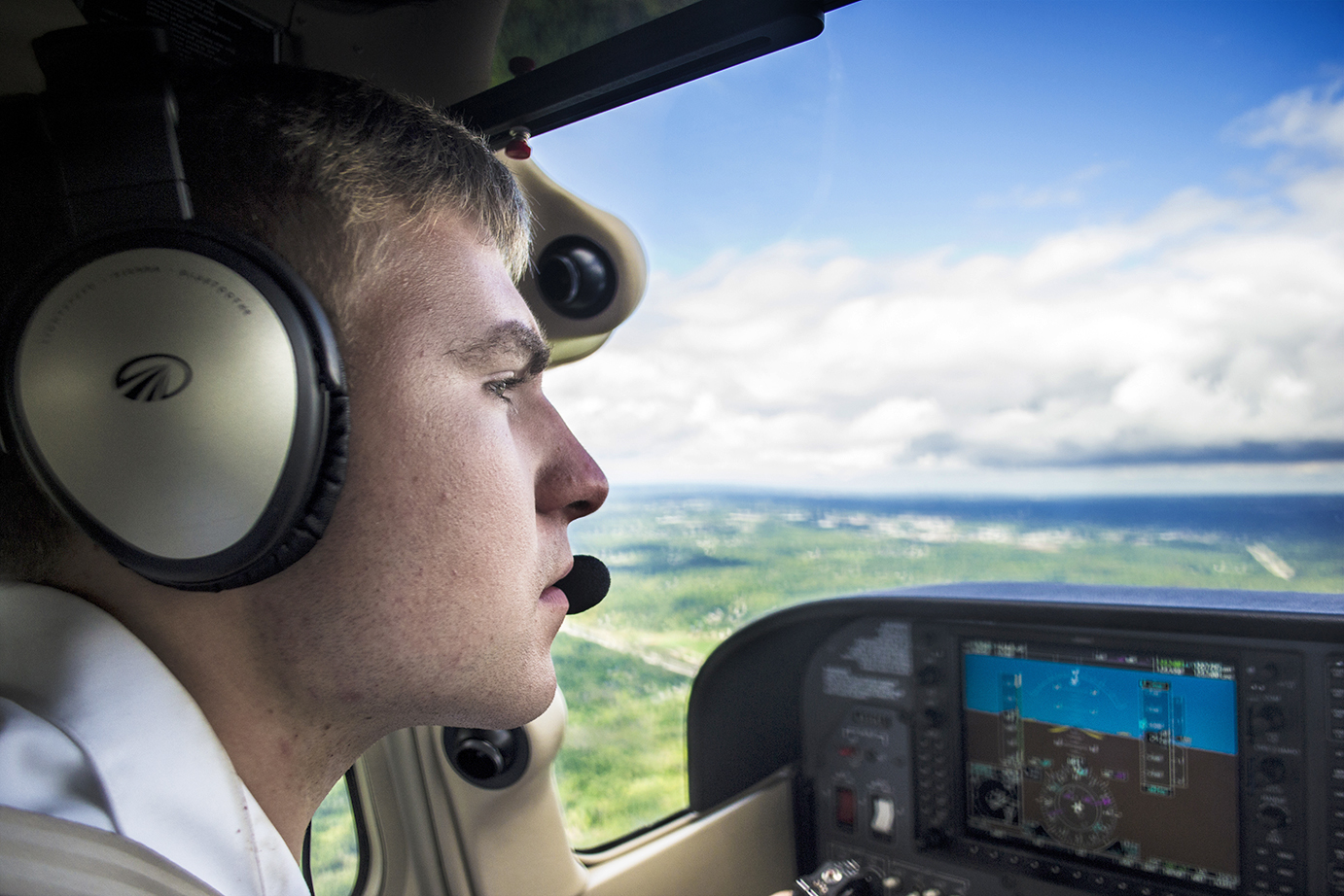 Senior flight tech major Brandon Taylor flies visitors to the Aviation Heritage Festival at the Kent State Airport on air tours around Portage County on Sept. 13, 2014. Original story available at kentwired.com