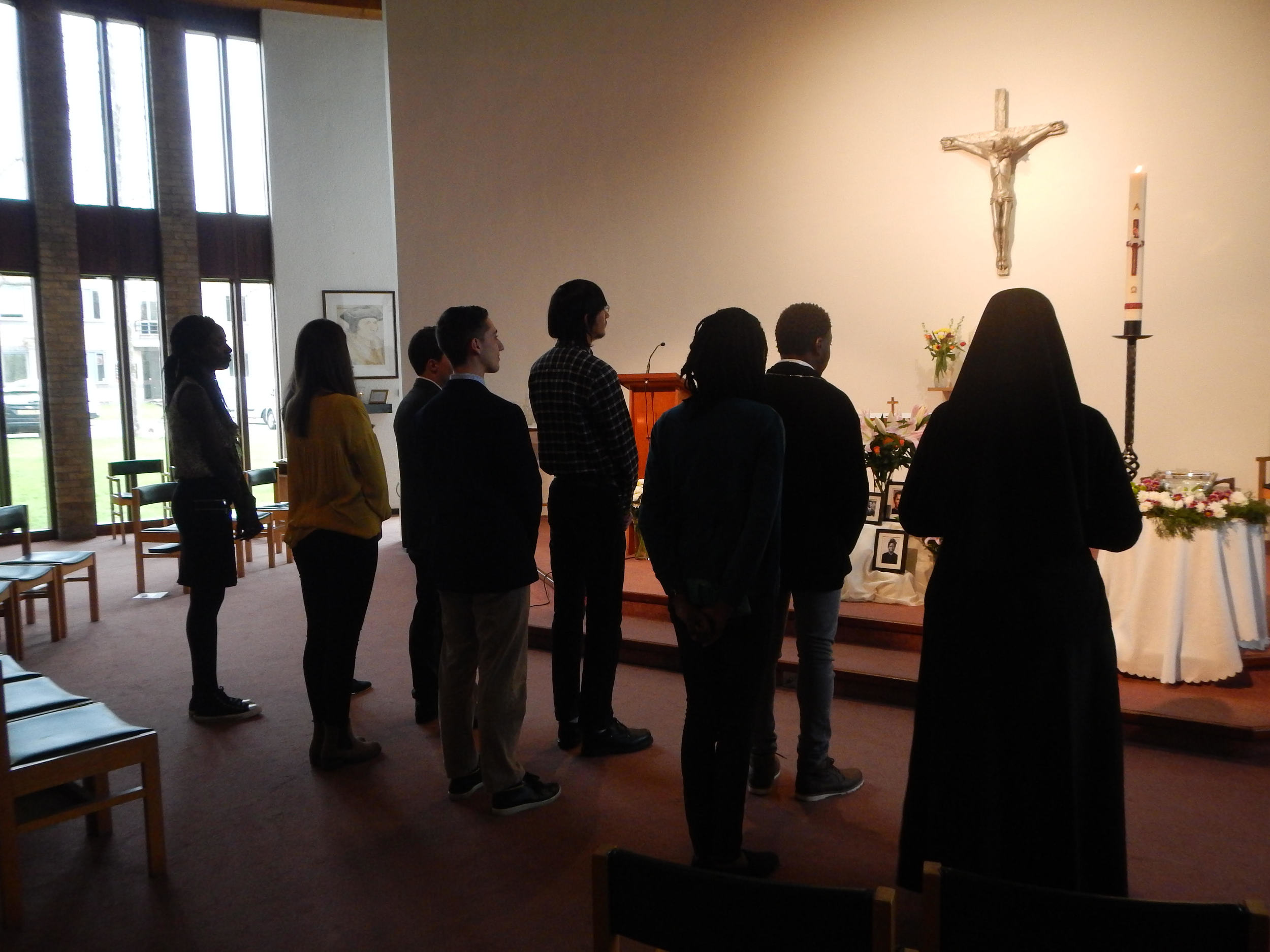 The five students for Confirmation were called forward with their sponsors. Leaving the darkness, they desire to open their hearts to the Light.