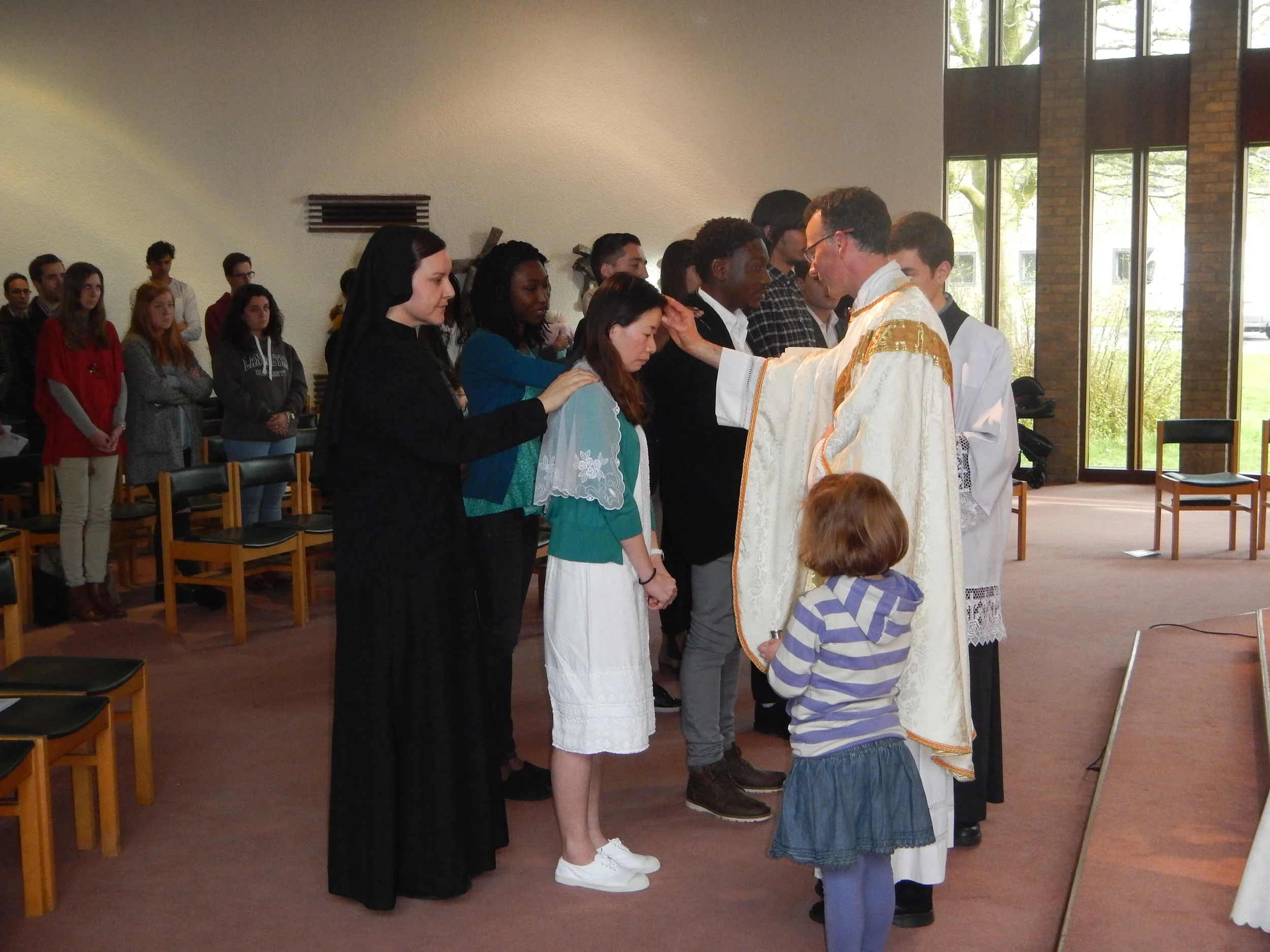 Receive the Holy Spirit. Each of those being confirmed is anointed with Holy Chrism, oil blessed by the Bishop, liquid Holy Spirit.