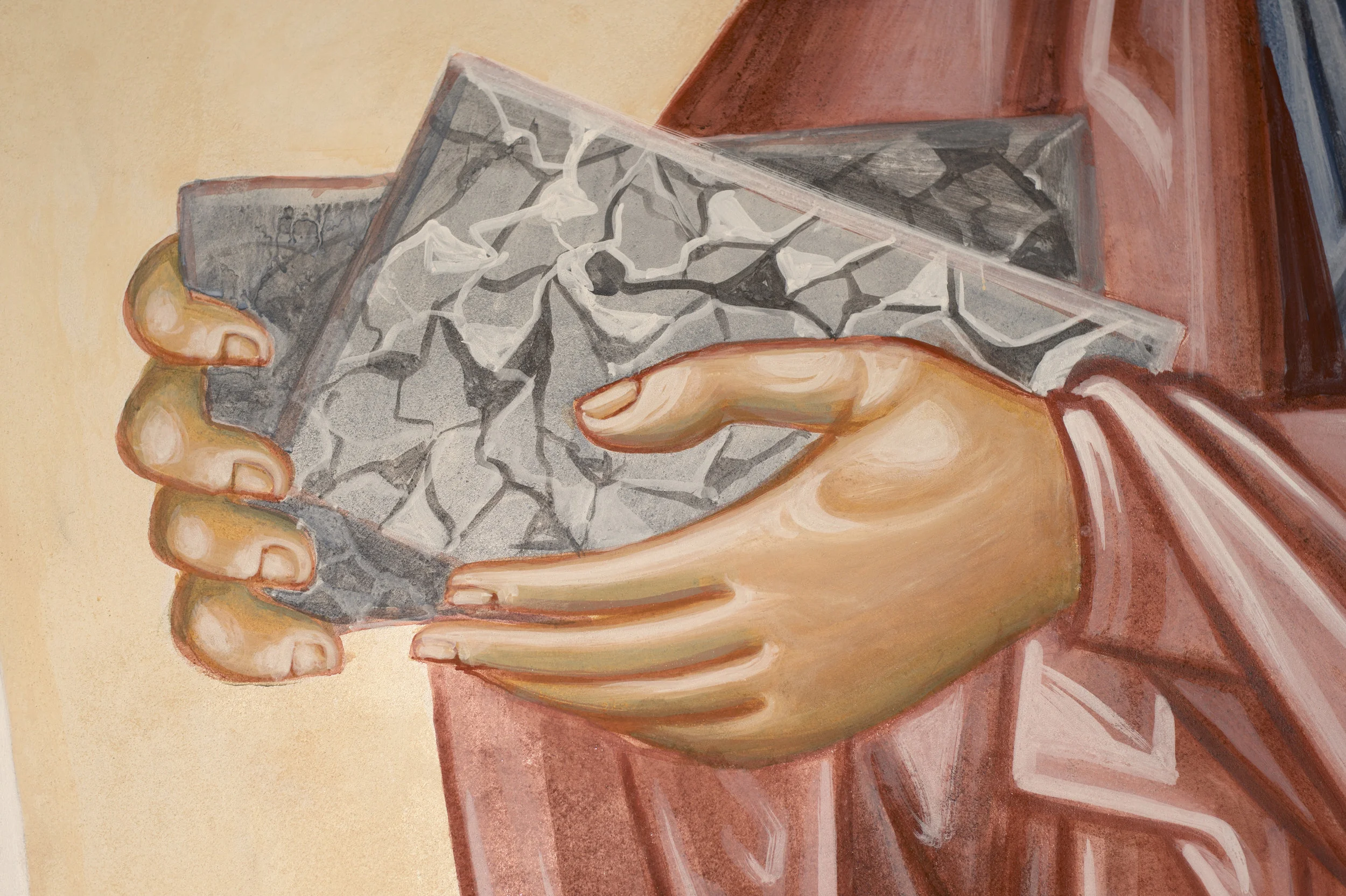 The tablets of stone on which the Law was written, held by Moses.