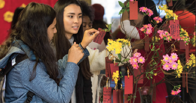 Tiffany Nguyen, left, Swikritis Pandyal enjoy Chinese new year celebration at Richland.