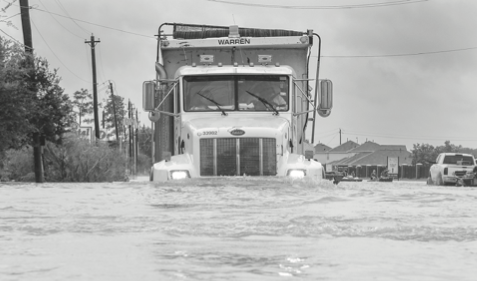 A truck tries to make it through the flooding in Houston.