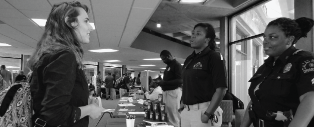 Richland senior Anna Tanner, left, talks with representatives from the Dallas Police Department at last year's job fair.