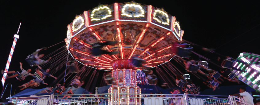 The swing ride on the Midway illuminates the night at The Texas State Fair, which continues through Oct. 22 at Dallas Fair Park. 