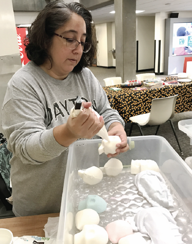 Professor Michelle Navarro, makes sugar skull for the bake sale on Nov. 2.