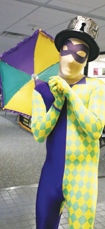 A Mardi Gras harlequin entertains in the El Paso Student Lounge on Fat Tuesday Feb. 13.