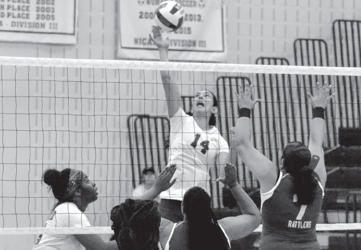 Lorena Perez climbs high to smash the ball for the victory against S.W.C.I.D on Aug. 31.
