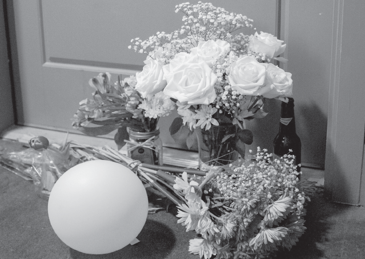 Flowers at the front door of Botham Jean’s apartment on Sept. 10.