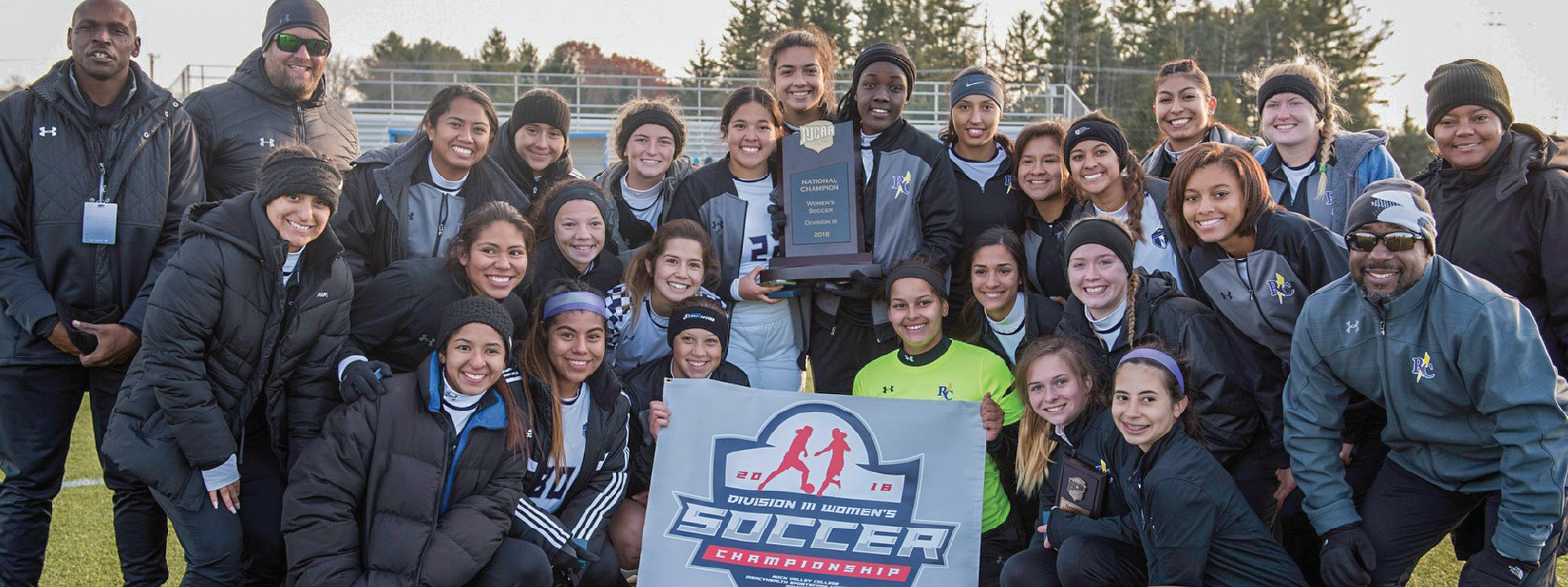 The Richland women’s soccer team poses for a photo with the coaches after winning the Div. III national championship in a battle against Delta College in Loves Park, Ill.