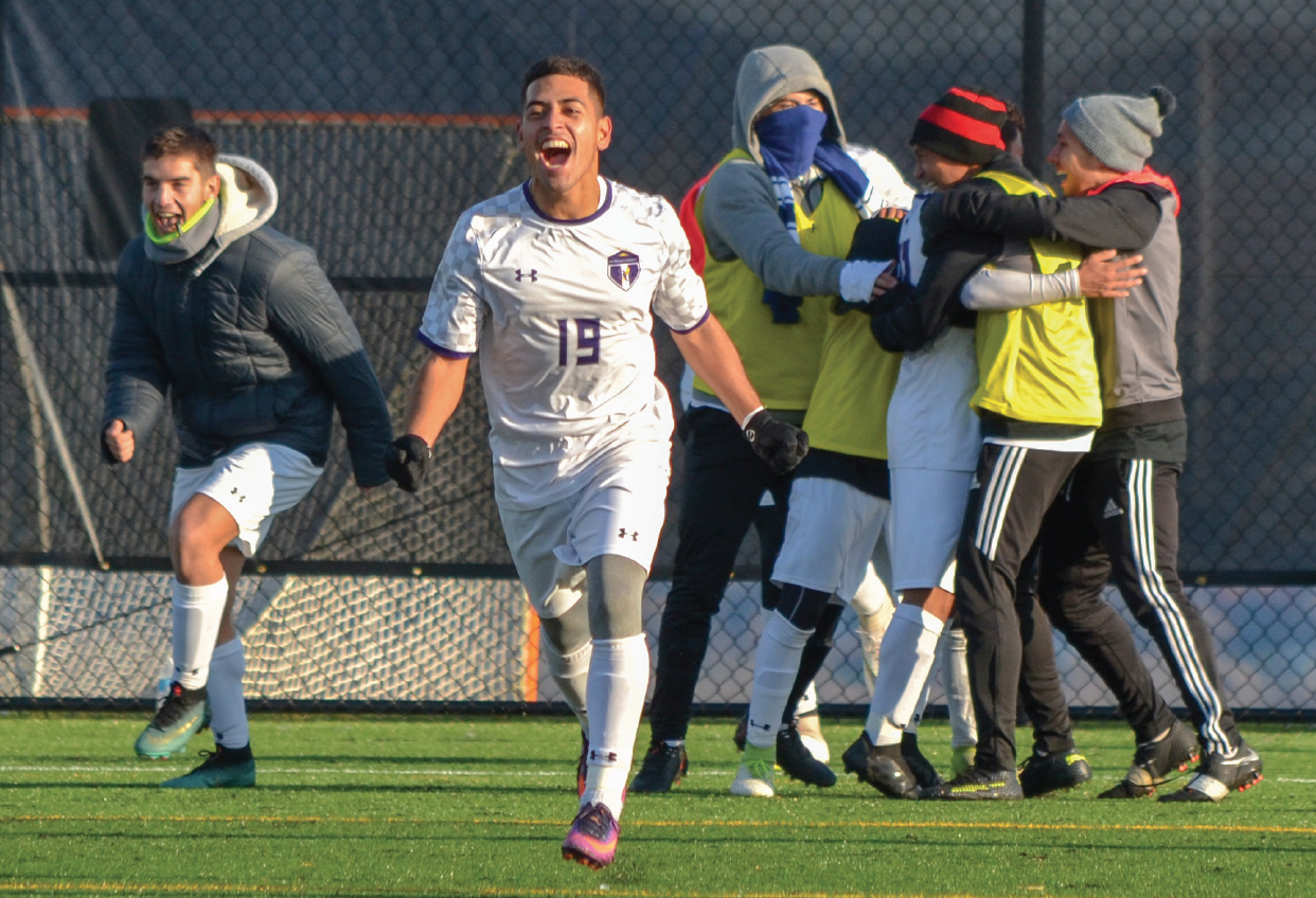 Carlos Valdez, center celebrates Richland’s victory over Nassau in the championship game in Herkimer, New York, Nov. 11.
