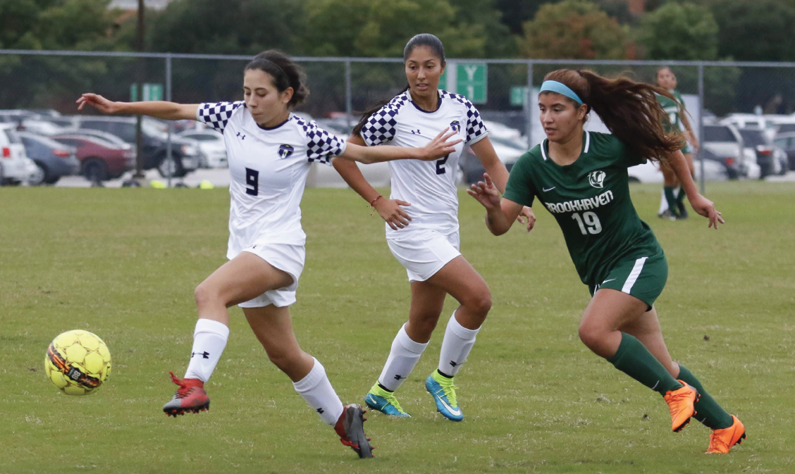 Ibarra, left, takes players on and dribbles away from a Brookhaven defender on Oct. 22. The Richland women’s team won the NJCAA Div. III national championship this year.