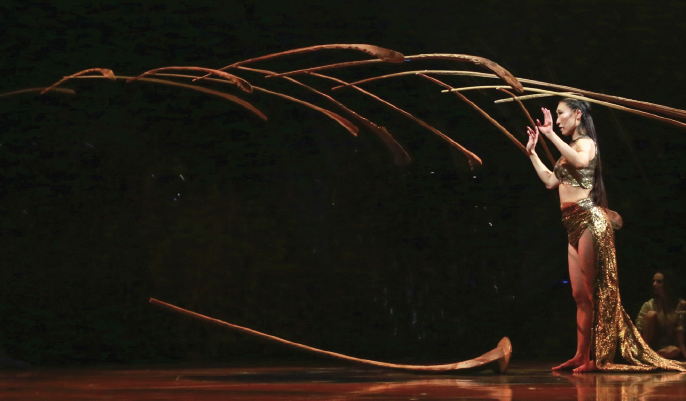 An breath-taking balancing act by the Balance Goddess with palm leaf ribs.