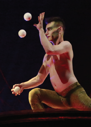 Cali juggles balls during his act.