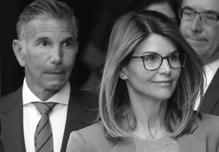 Lori Loughlin, and husband, clothing designer Mossimo Giannulli, left, depart federal court in Boston after facing charges in a nationwide college admissions bribery scandal.