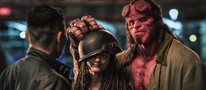 Actors Sasha Lane and David Harbour as Alice Monaghan and Hellboy.
