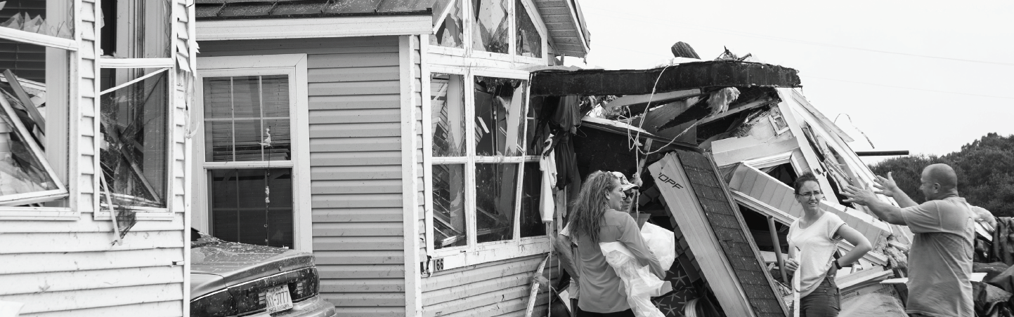 Residents from the Boardwalk RV Park in Emerald Isle, North Carolina discuss and observe the damage left by a waterspout or tornado formed from Hurricane Dorian.