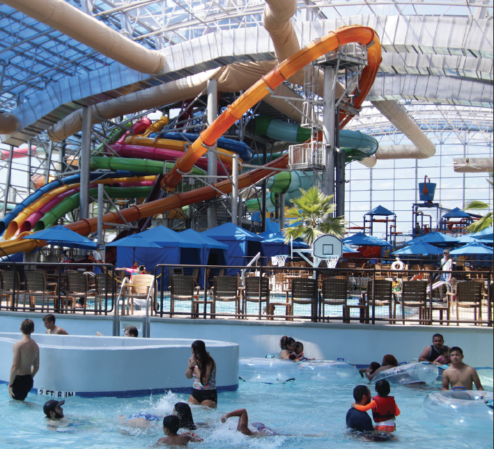 Guests splash and slide around at the Epic Waters Indoor Waterpark