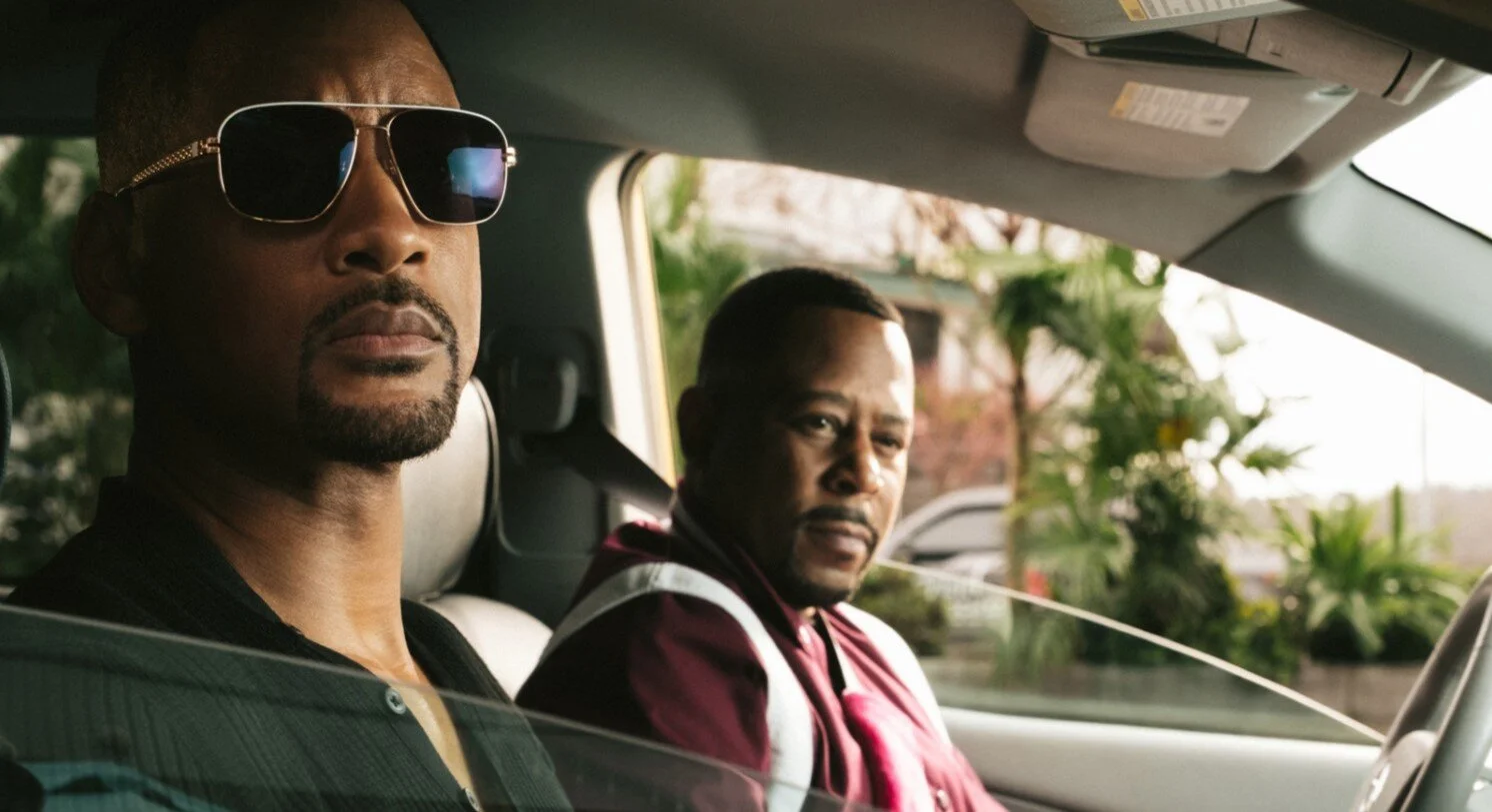 Will Smith, left and Martin Lawrence are on the lookout from their car. Photo courtesy IMDb