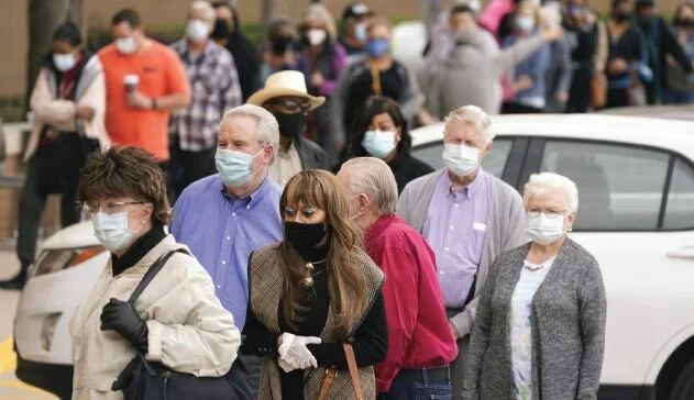 People wait in line to receive a COVID-19 vaccination at Methodist Hospital in the Oak Cliff neighborhood of Dallas on March 2. Photo The Associated Press