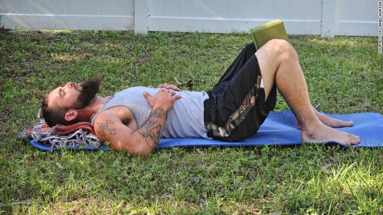 Lie on your back with your knees bent and feet flat, hip-distance apart, 6 to 8 inches from your bottom.