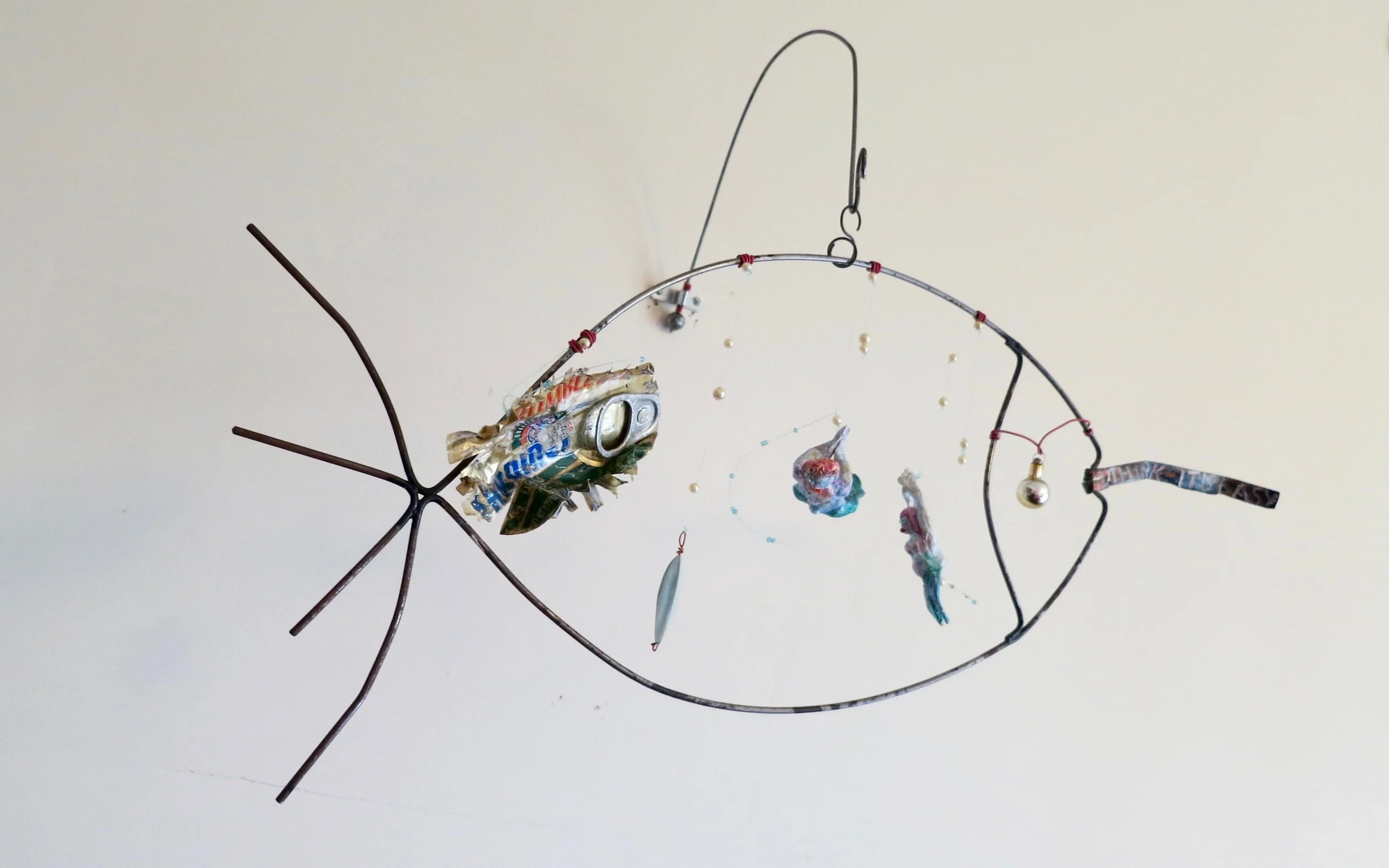 Mixed media mobile, "Think it's easy swallowing this?"