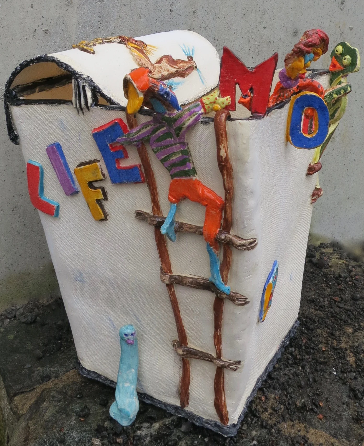 "Modern Life," a ceramic sculpted wastebasket, complete with its spirit below