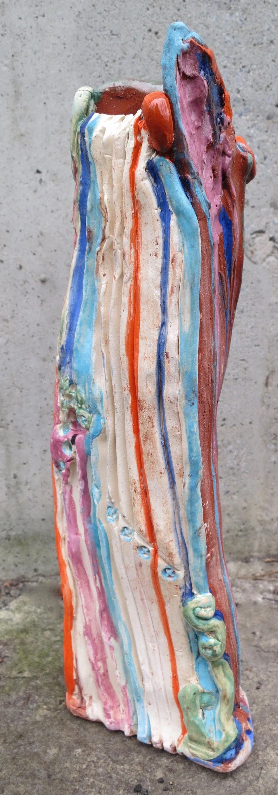 one view of Solstice Cloud Memory, a triangular abstract sculpture, 12’’ tall by 4’’ wide
