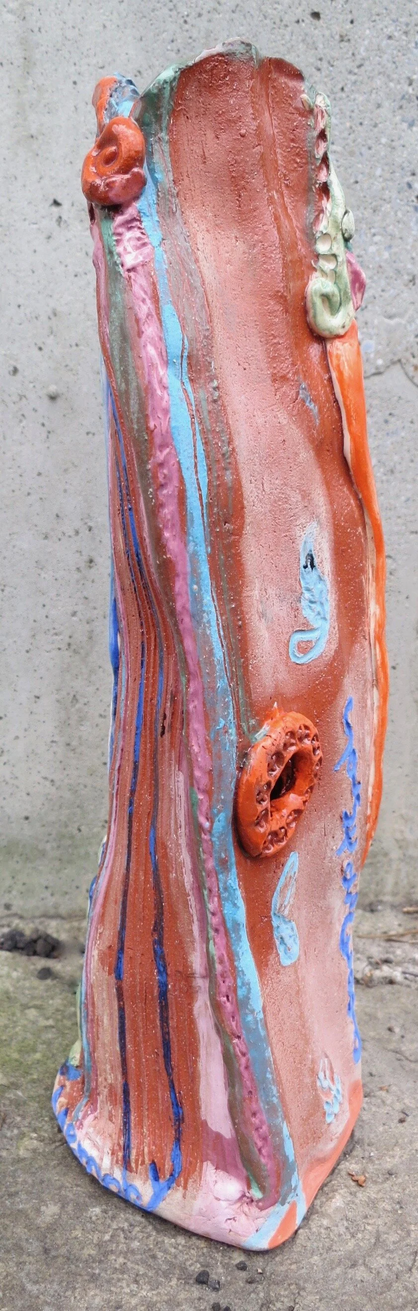 another view of Solstice Cloud Memory, a triangular abstract sculpture, 12’’ tall by 4’’ wide