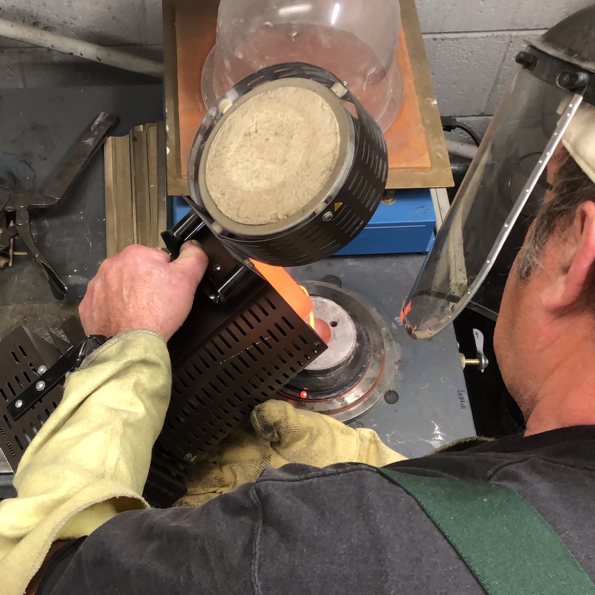 5. When the mold is hard and empty, it is filled with the molten metal, usually bronze. A vacuum is used beneath the mold to pull the metal into every crevice.
